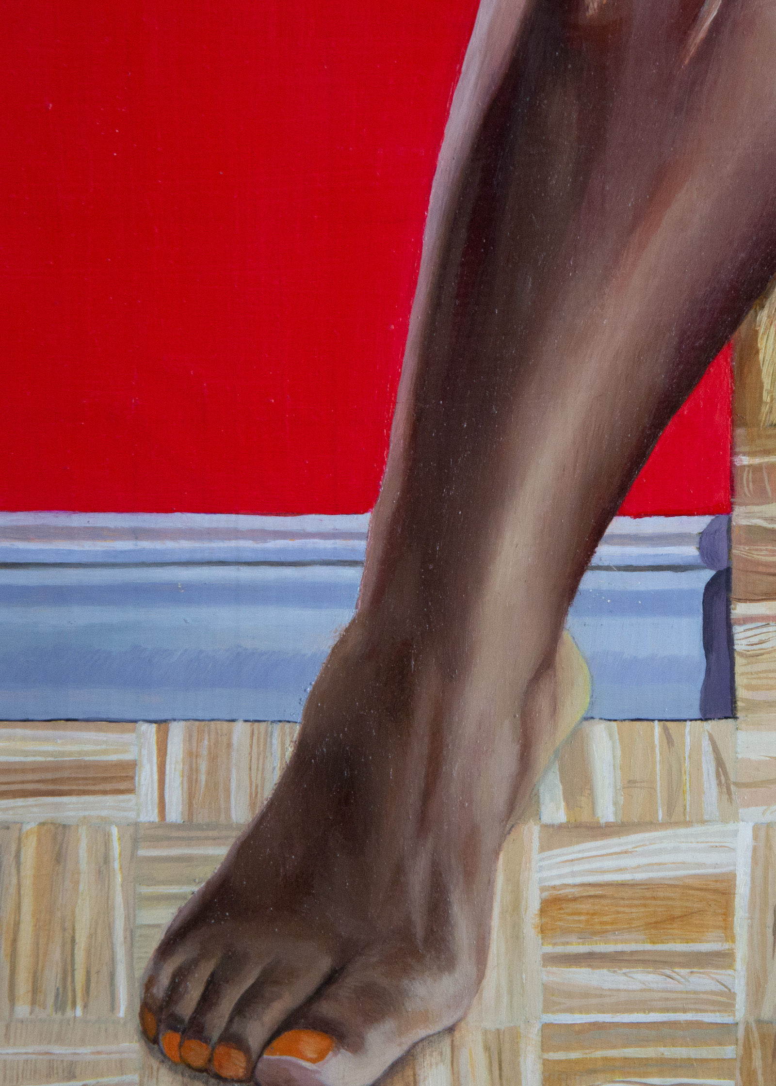 Close up of a person's leg as the step from one room into another behind an open door