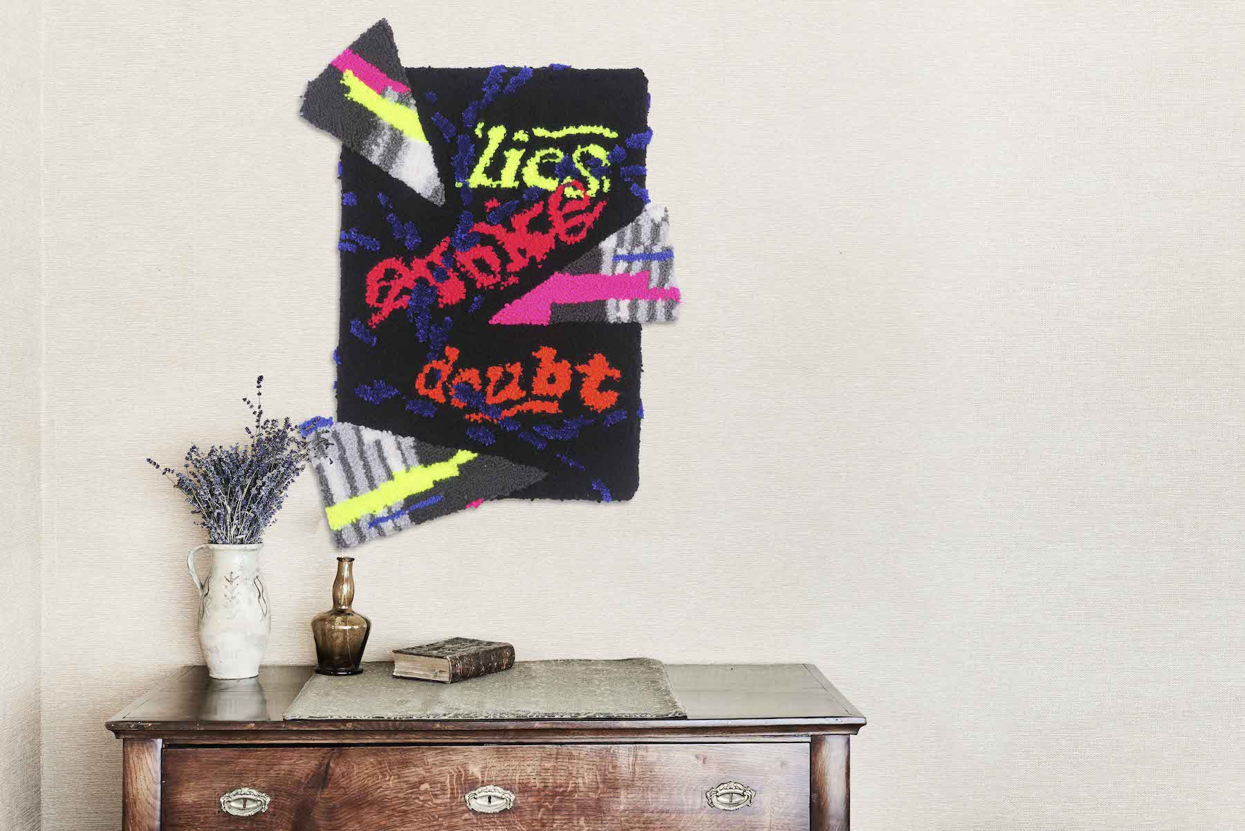 Multicolored fabric pieces glued together with text saying lies evoke doubt