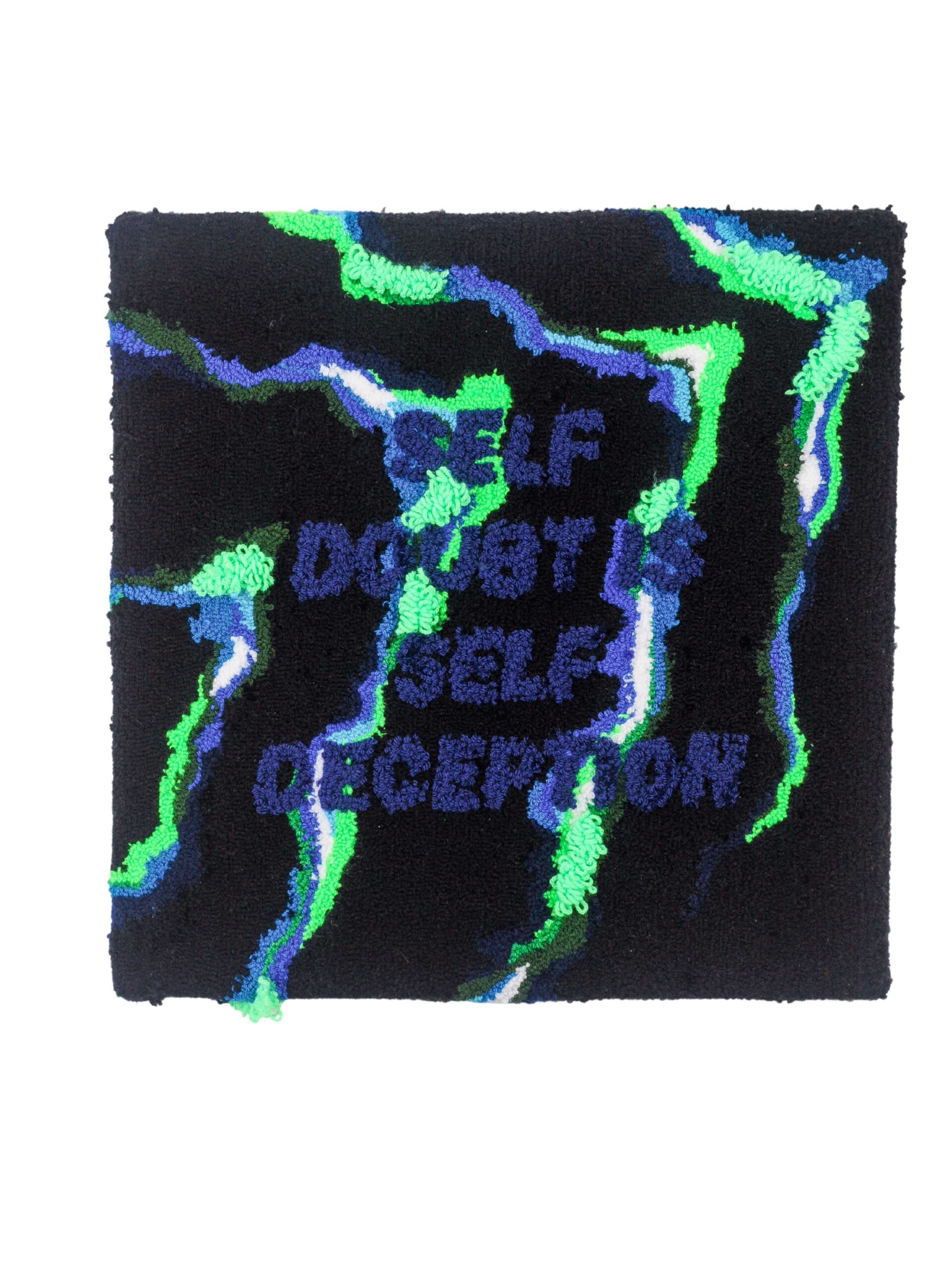 Fabric glued together in neon green, blue, and black with text