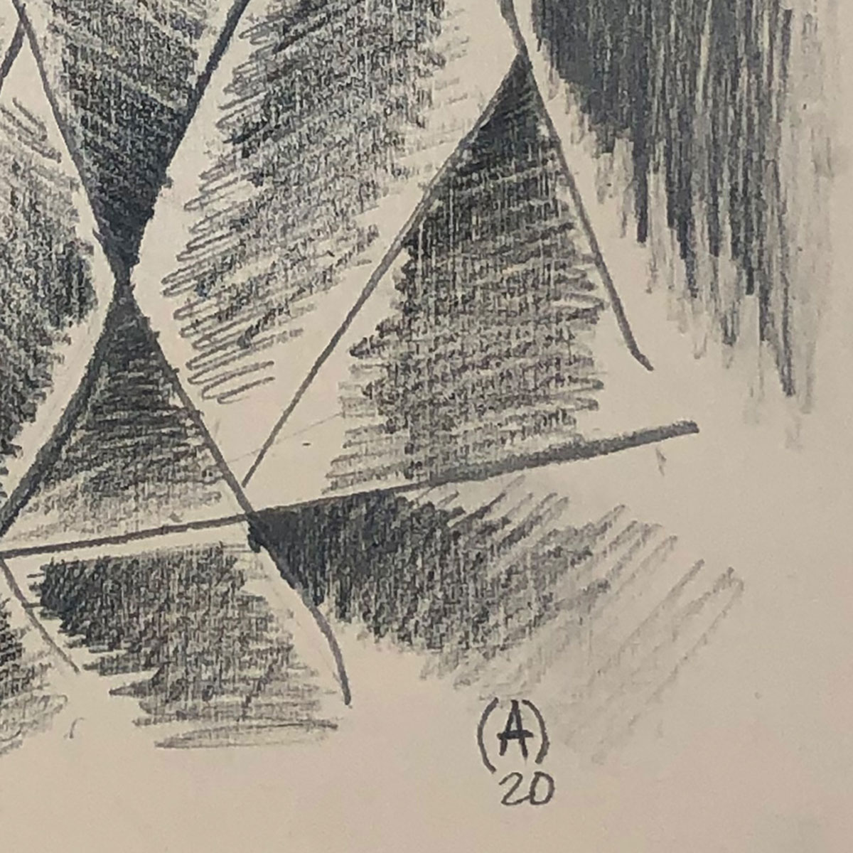 Graphite drawing of shaded triangular shapes in gray against a white backdrop