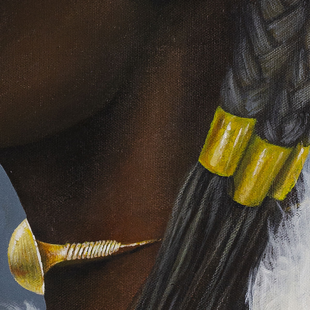 Side profile of a woman with braided hair and gold choker